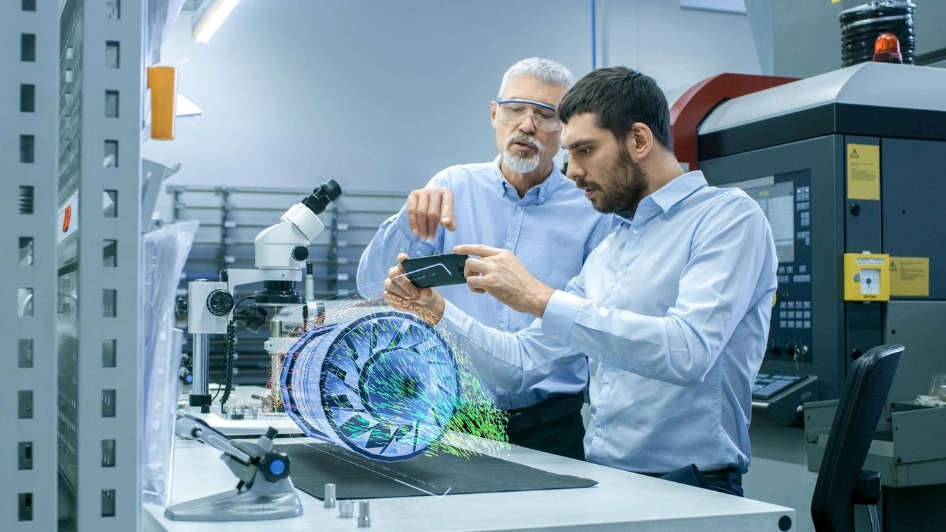 Two men looking at a computer screen